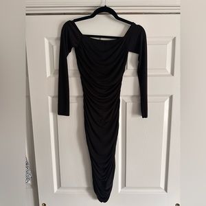 Long sleeve off the shoulder black fitted dress.